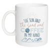 the sun and the sand with coffee in my hand mug